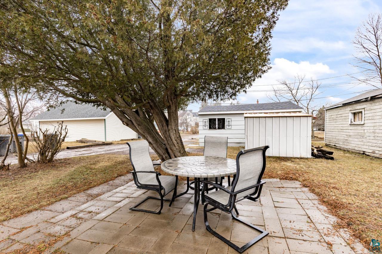 607 3rd Avenue East Superior, WI 54880 - Photo 34 of 41 View of patio / terrace with outdoor dining area and an outbuilding