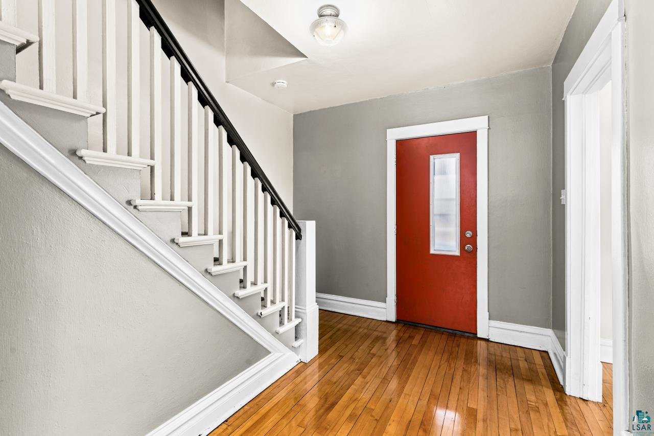 607 3rd Avenue East Superior, WI 54880 - Photo 4 of 41 Entryway featuring stairway and light wood finished floors