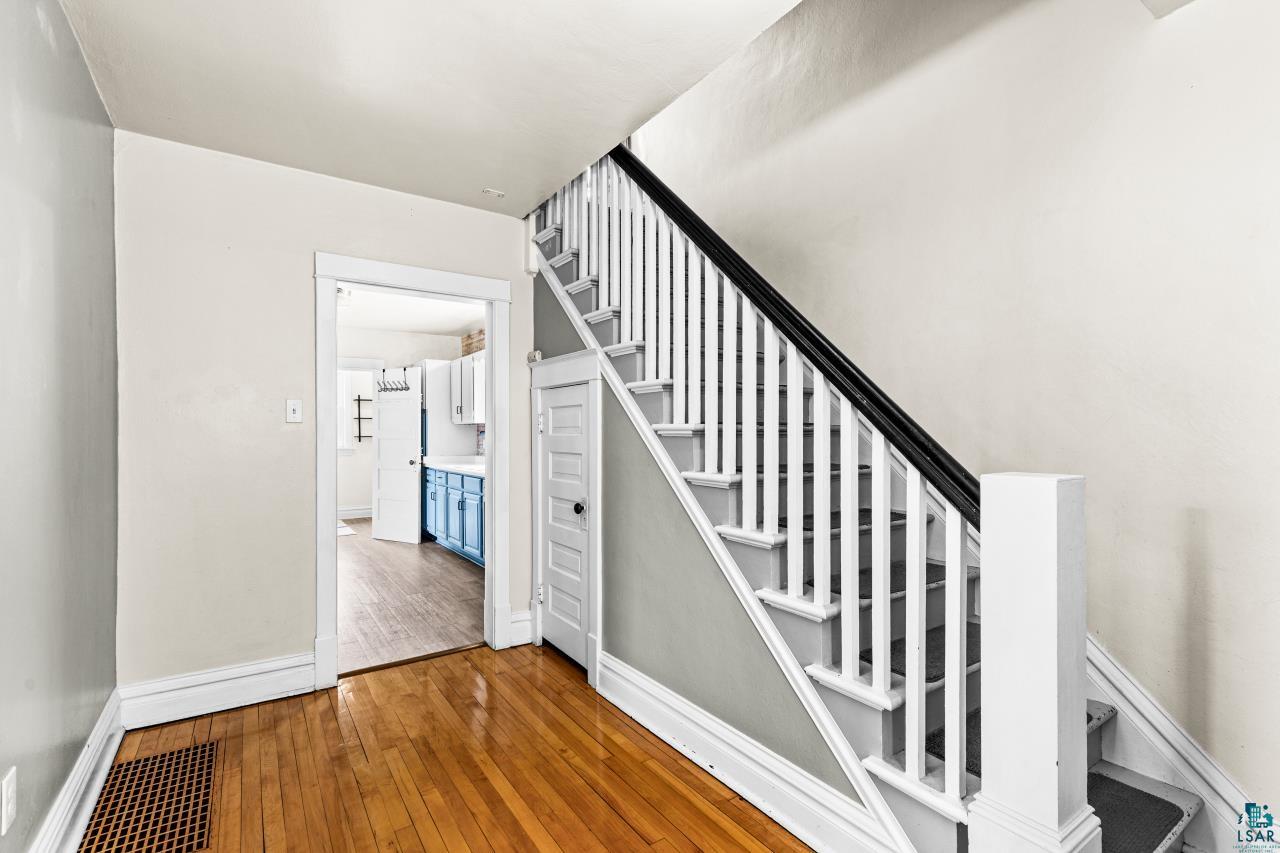 607 3rd Avenue East Superior, WI 54880 - Photo 5 of 41 Stairway featuring wood-type flooring and baseboards