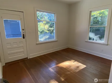 a kitchen with a refrigerator and a sink