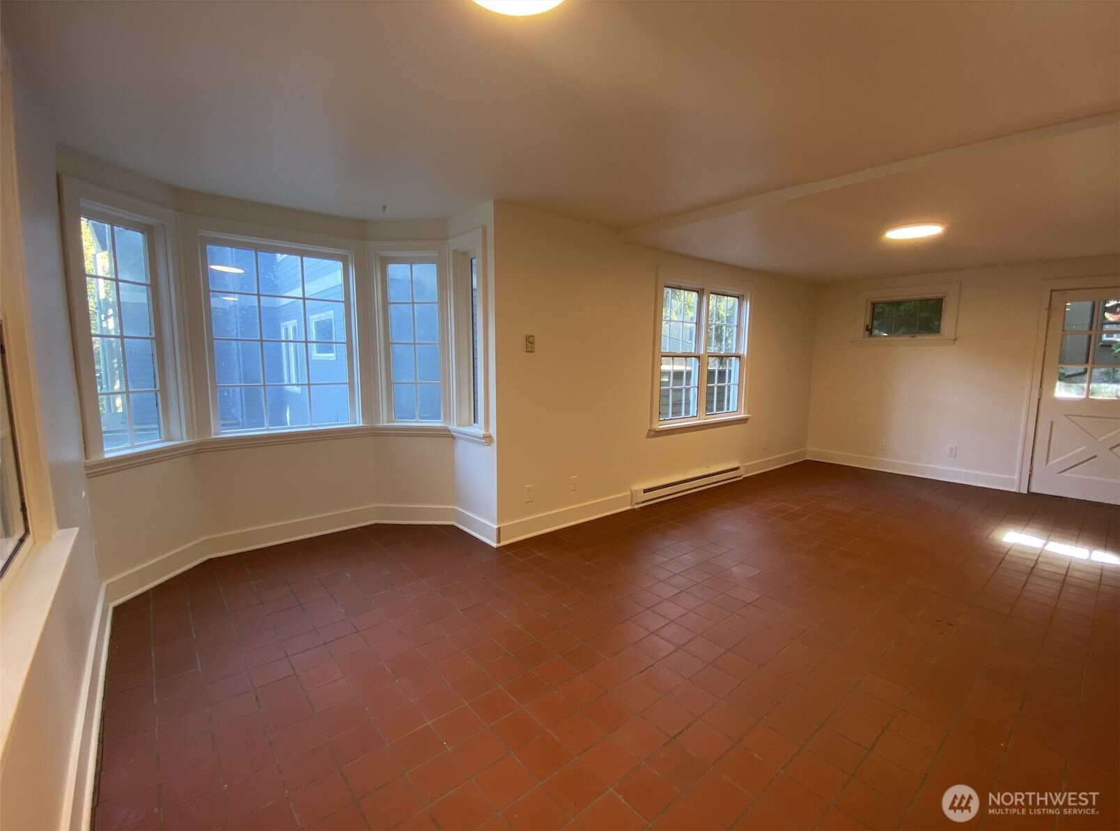 2611 3rd Avenue West Seattle, WA 98119 - Photo 3 of 13 an empty room with windows