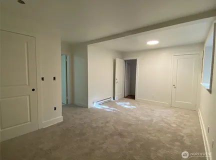 a view of an empty room and closet area