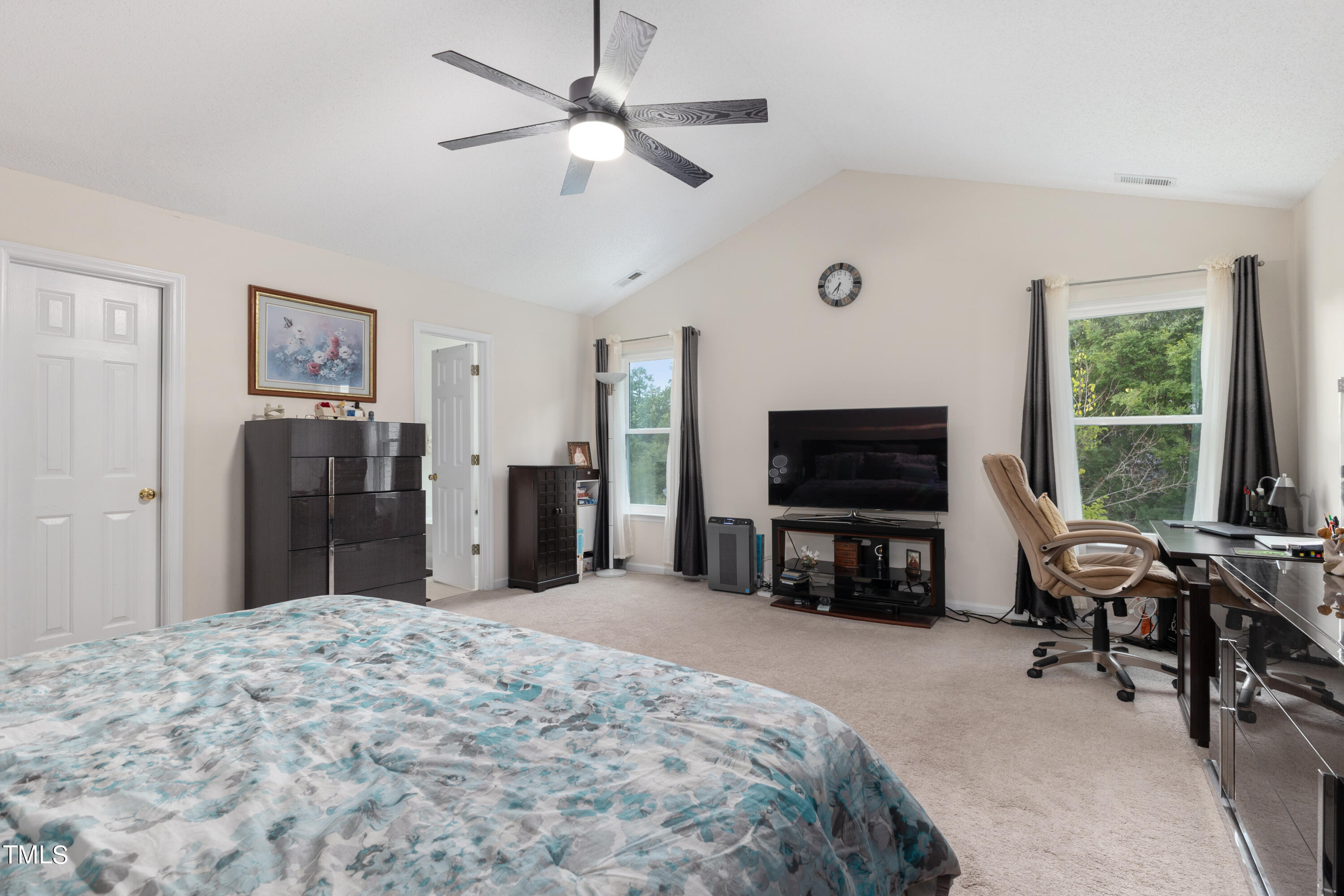 3 Weeping Beech Way Durham, NC 27713 - Photo 11 of 26 a bed room with a bed a television and a large window