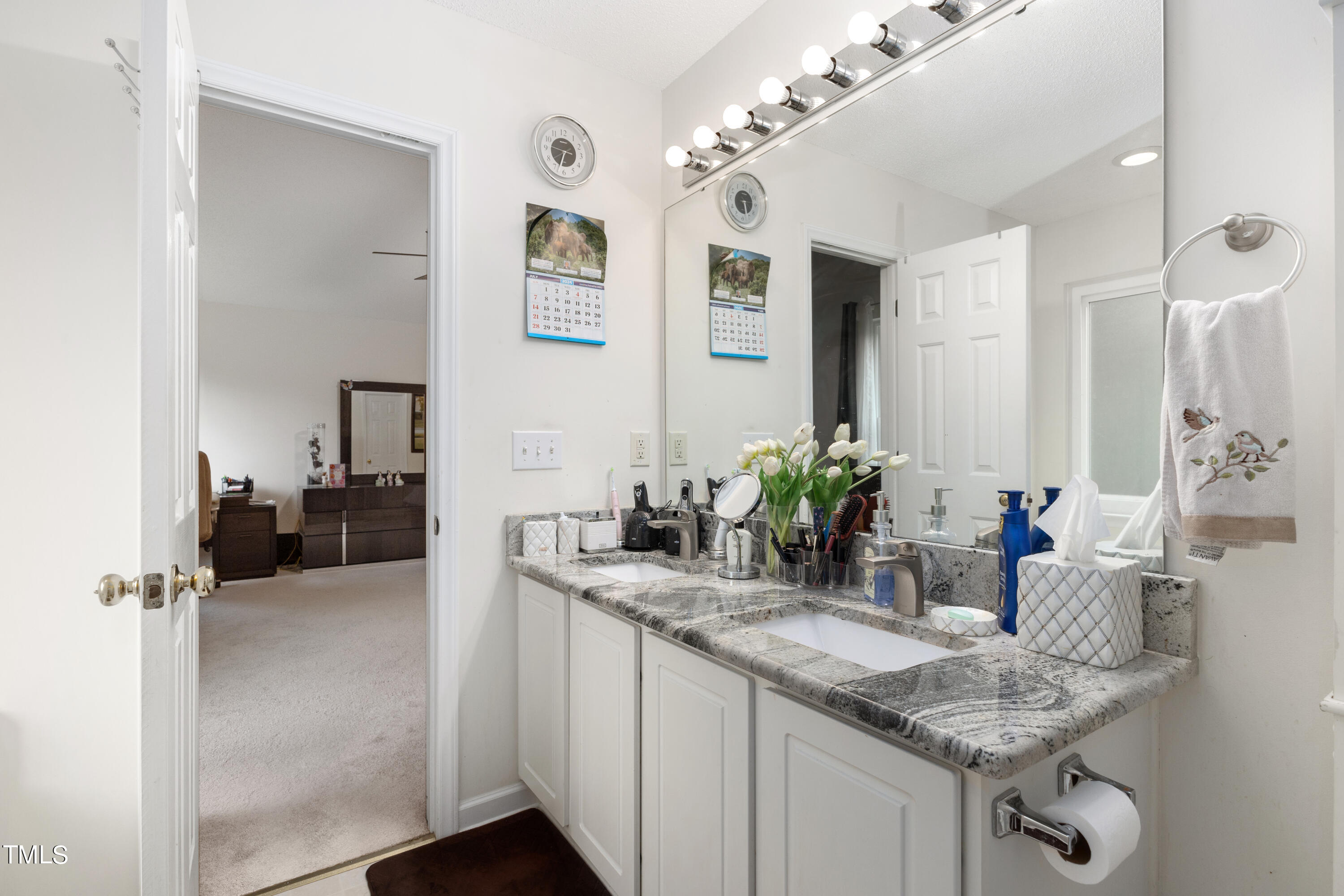 3 Weeping Beech Way Durham, NC 27713 - Photo 13 of 26 a bathroom with a granite countertop sink a mirror and shower