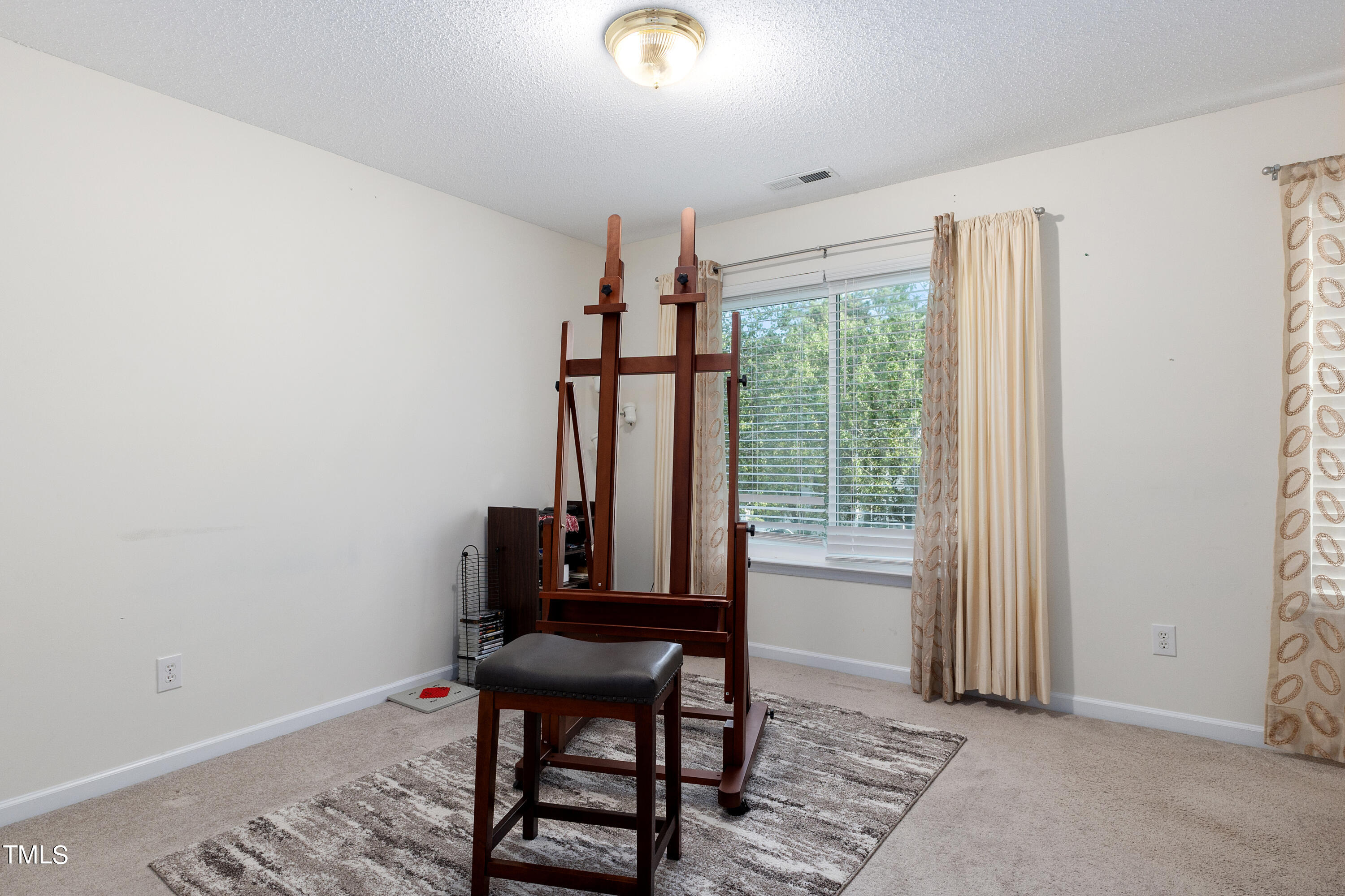3 Weeping Beech Way Durham, NC 27713 - Photo 15 of 26 a view of a workspace with furniture and a window
