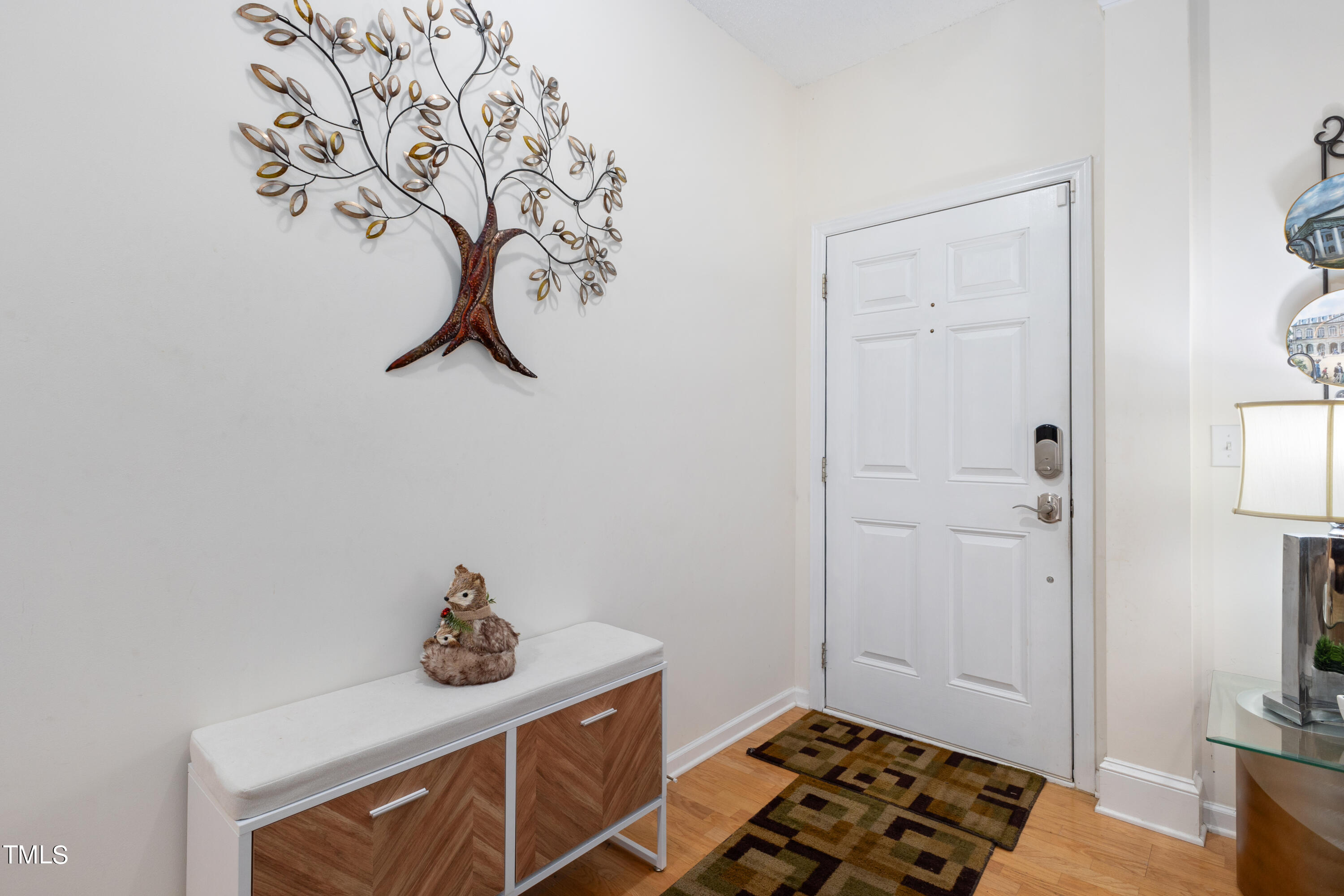 3 Weeping Beech Way Durham, NC 27713 - Photo 18 of 26 a room with a table and a chandelier