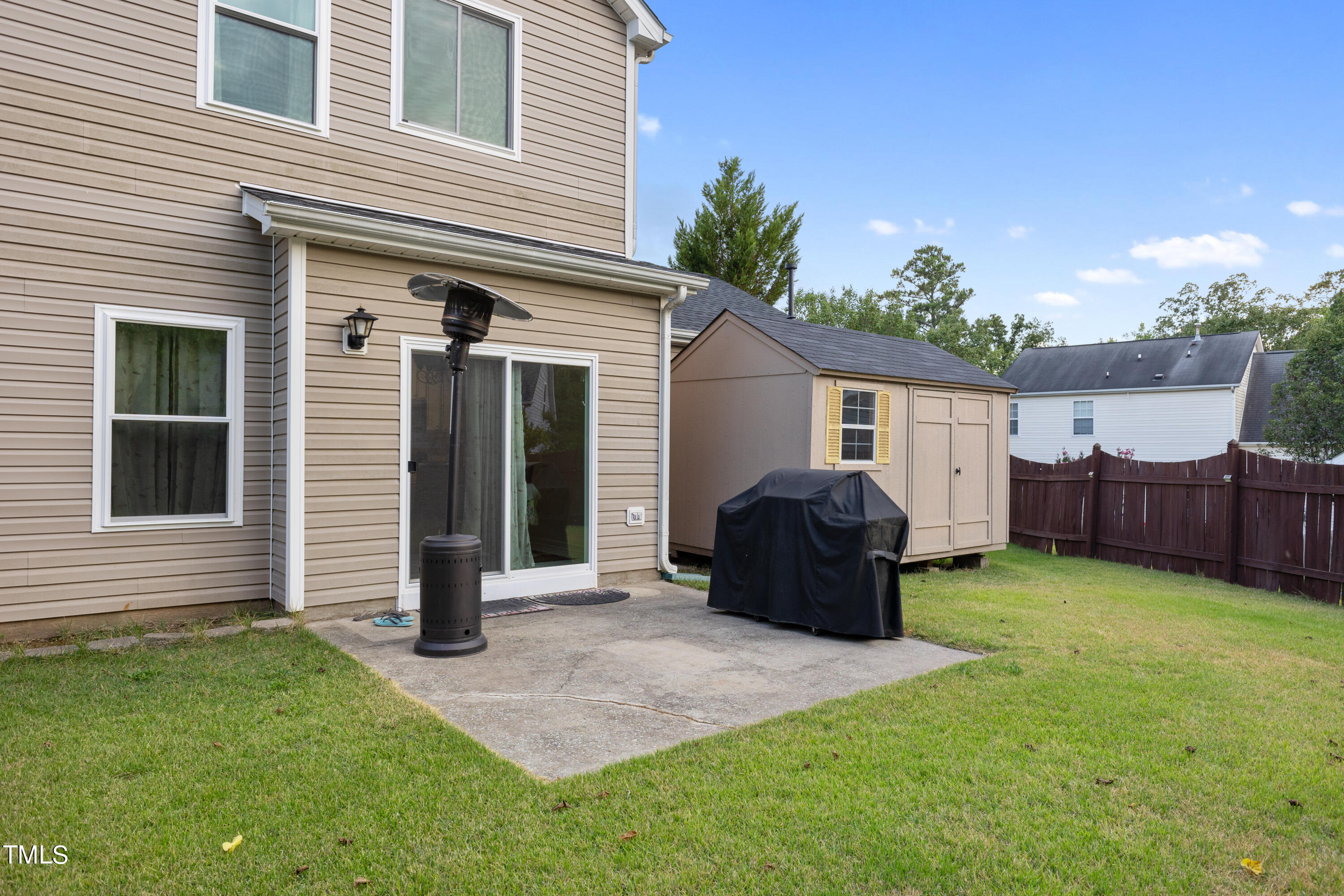 3 Weeping Beech Way Durham, NC 27713 - Photo 23 of 26 a front view of a house with a yard and garage