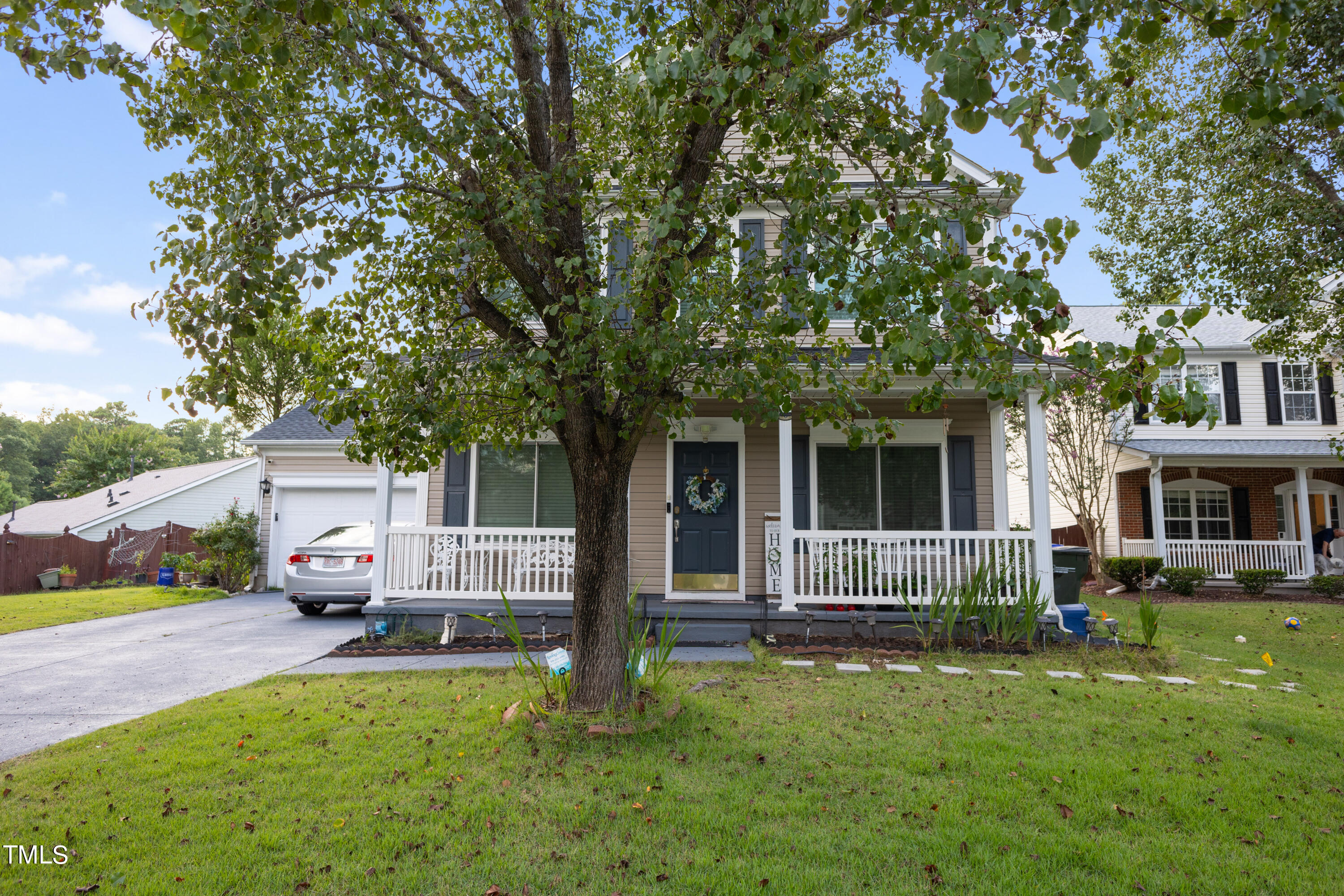 3 Weeping Beech Way Durham, NC 27713 - Photo 25 of 26 a front view of a house with a garden and trees