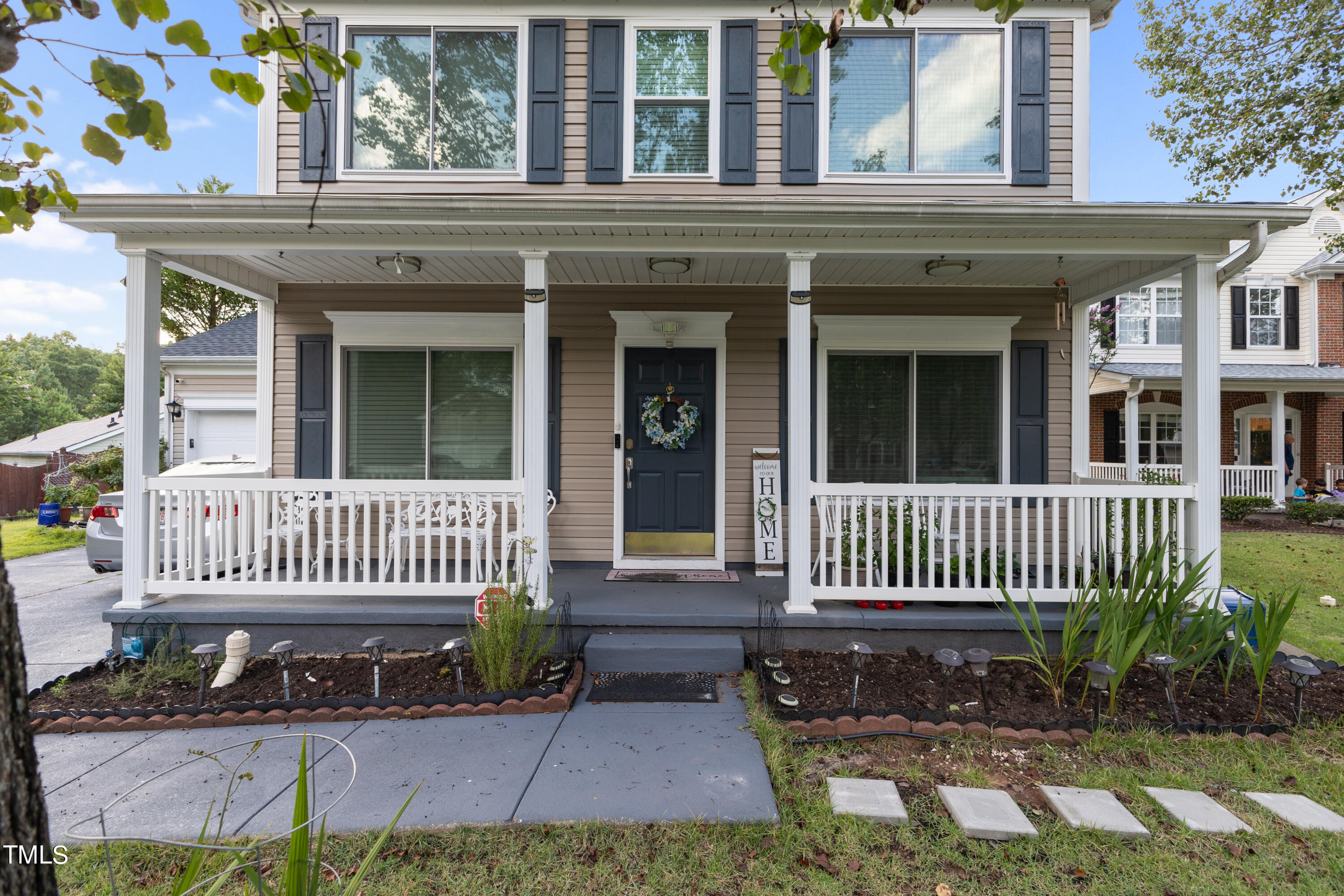 3 Weeping Beech Way Durham, NC 27713 - Photo 26 of 26 front view of a house with a bench