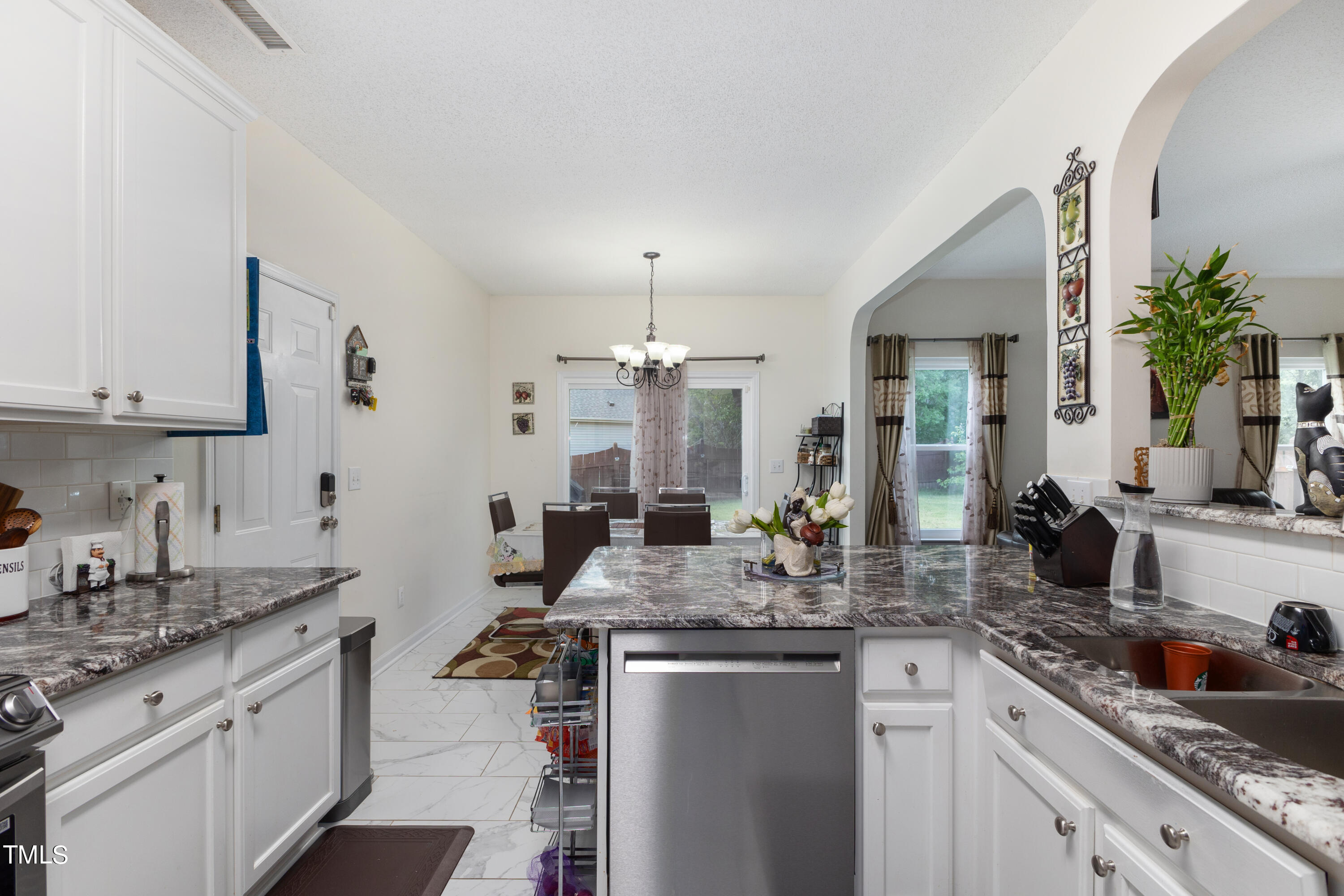3 Weeping Beech Way Durham, NC 27713 - Photo 4 of 26 a kitchen with sink stove and cabinets