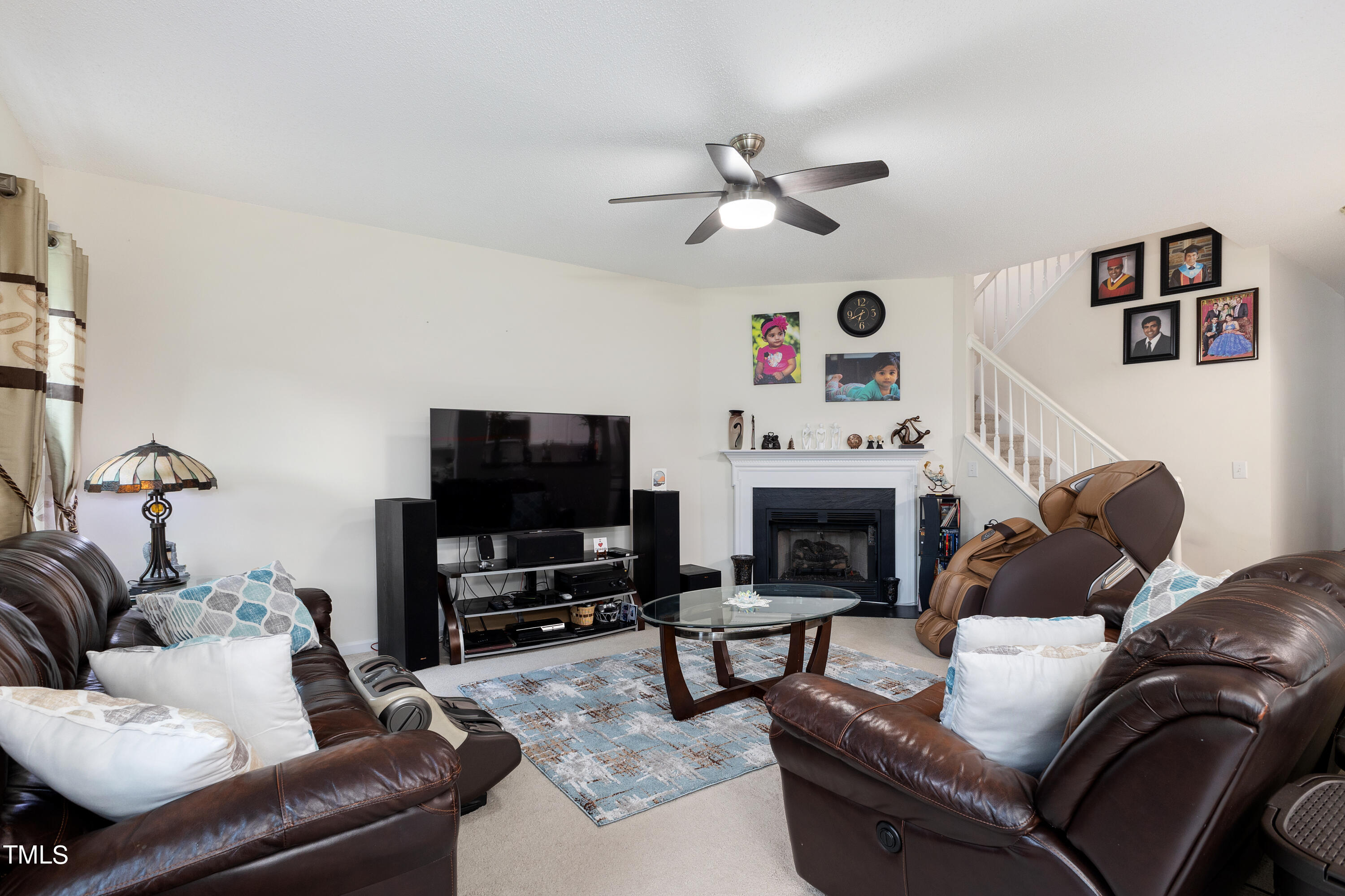 3 Weeping Beech Way Durham, NC 27713 - Photo 7 of 26 a living room with furniture a flat screen tv and a fireplace
