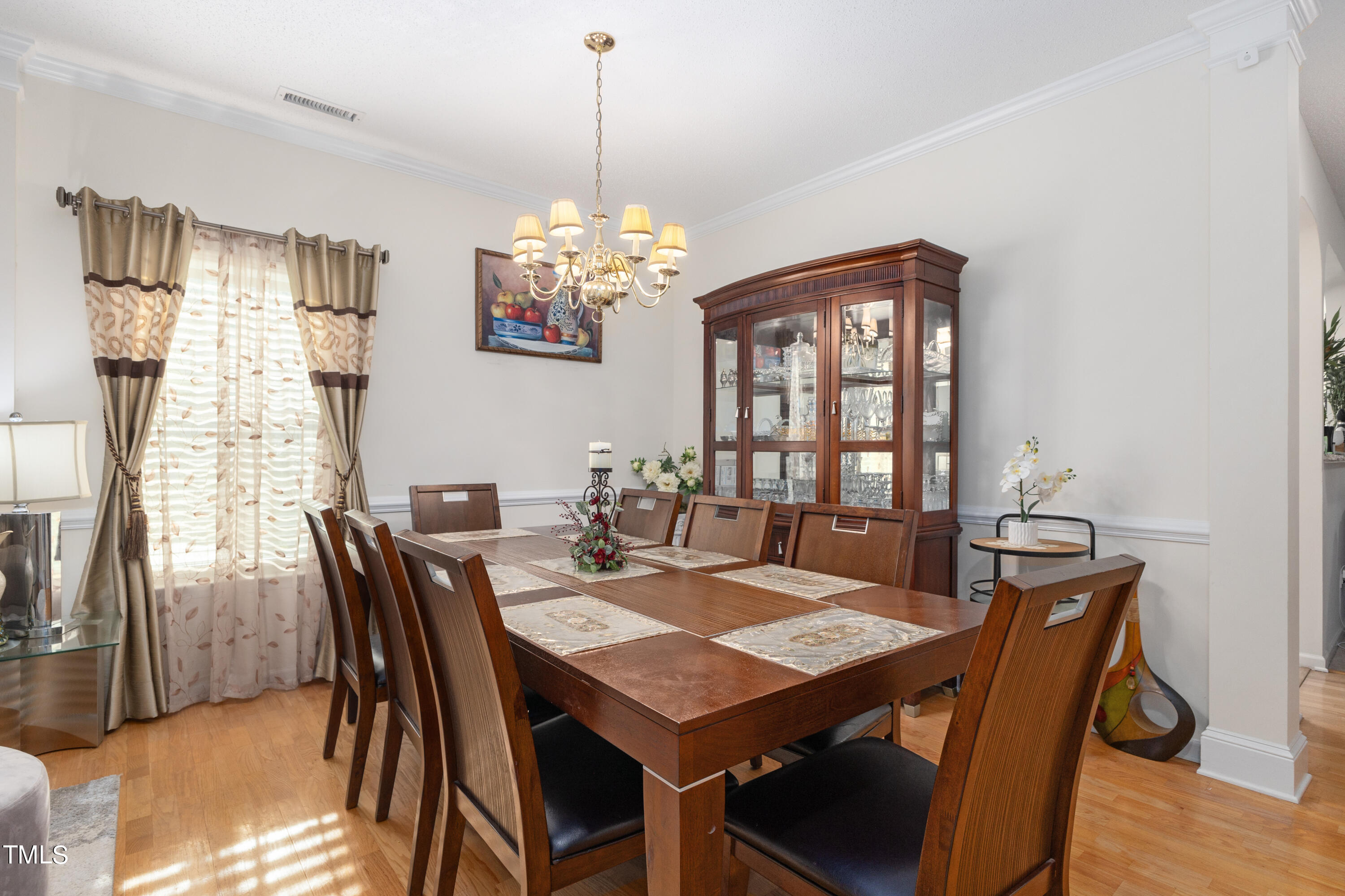3 Weeping Beech Way Durham, NC 27713 - Photo 9 of 26 a view of a dining room with furniture window and wooden floor