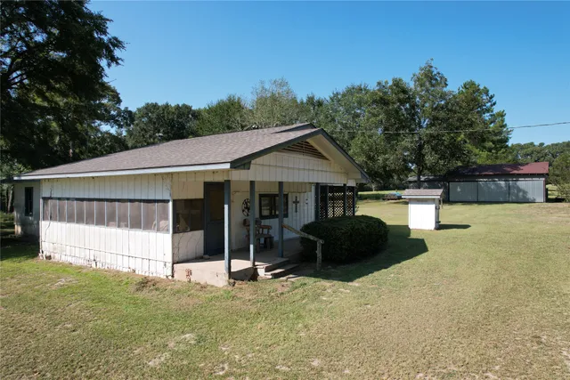 a house with trees in the background
