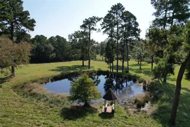 a view of a lake with a yard