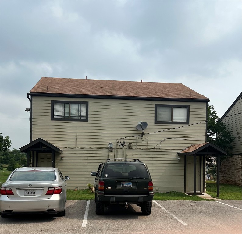 151-201 Springlake Drive Dripping Springs, TX 78620 - Photo 5 of 12 a car parked in front of a house