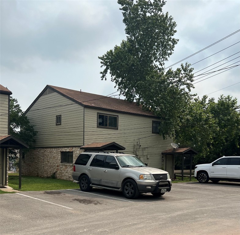 151-201 Springlake Drive Dripping Springs, TX 78620 - Photo 6 of 12 a car parked in front of a house