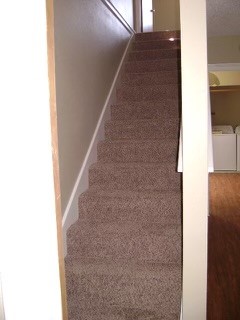 151-201 Springlake Drive Dripping Springs, TX 78620 - Photo 10 of 12 a view of staircase with white walls