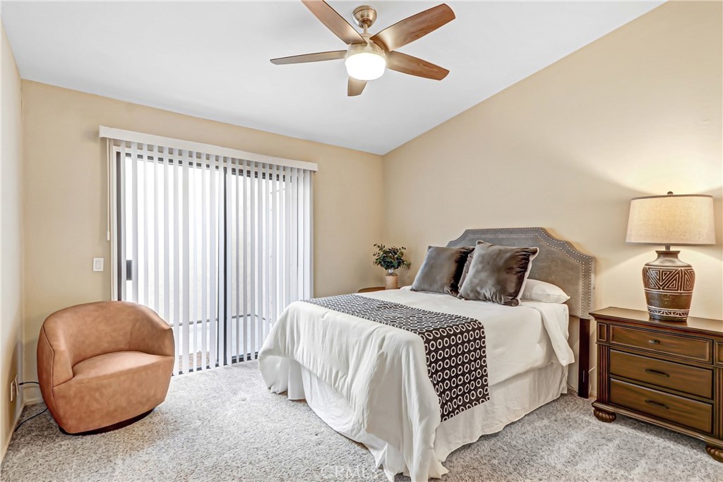9849 Allesandro Court Rancho Cucamonga, CA 91730 - Photo 12 of 20 a bedroom with a bed and a chandelier