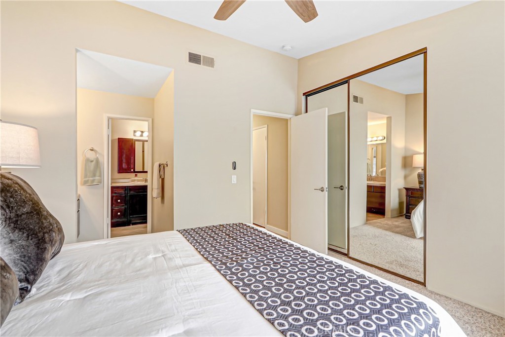 9849 Allesandro Court Rancho Cucamonga, CA 91730 - Photo 13 of 20 a bedroom with a bed and a walk in closet