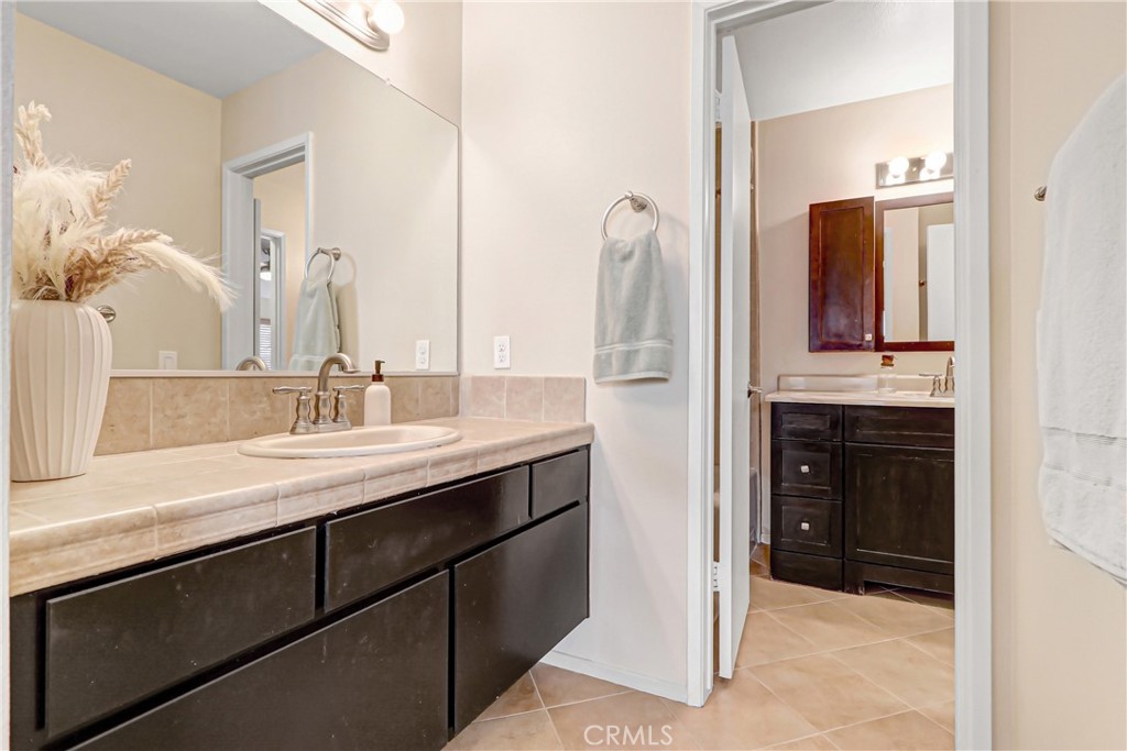 9849 Allesandro Court Rancho Cucamonga, CA 91730 - Photo 14 of 20 a bathroom with a sink and a mirror