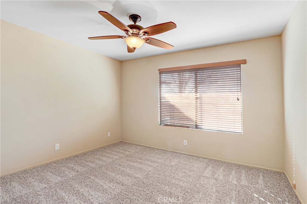 9849 Allesandro Court Rancho Cucamonga, CA 91730 - Photo 15 of 20 an empty room with a window and a fan