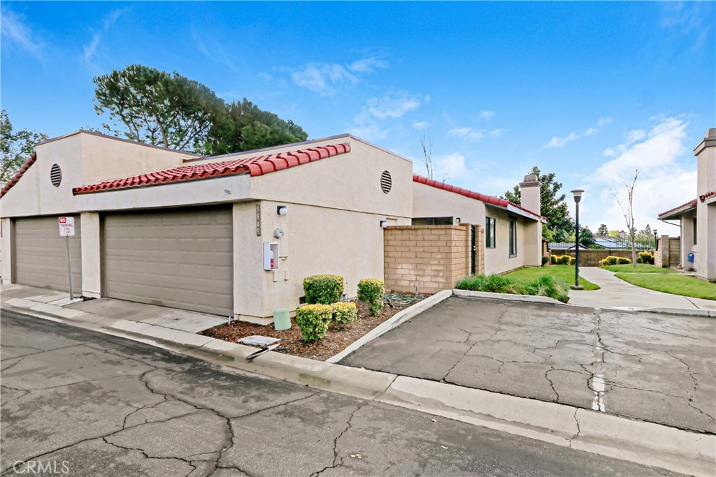 9849 Allesandro Court Rancho Cucamonga, CA 91730 - Photo 3 of 20 a front view of a house with a yard and garage
