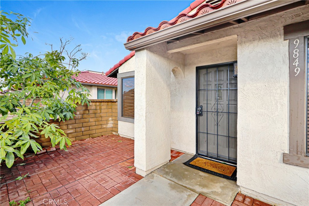 9849 Allesandro Court Rancho Cucamonga, CA 91730 - Photo 4 of 20 a yellow and red door of a house