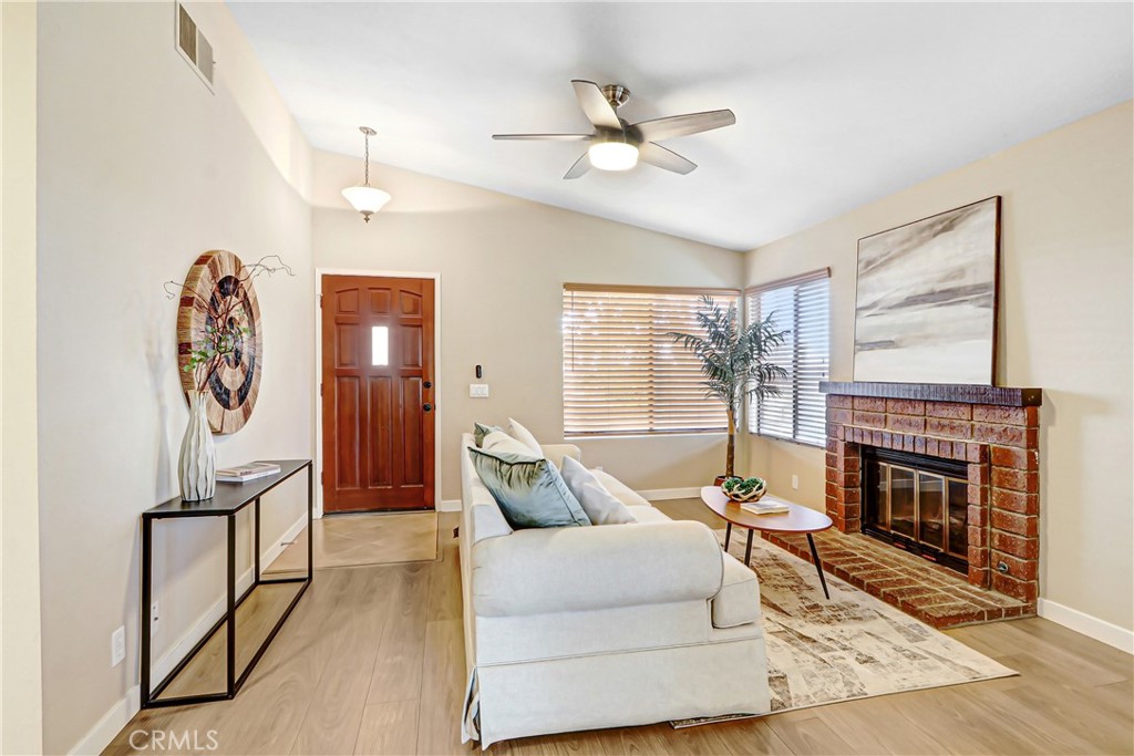 9849 Allesandro Court Rancho Cucamonga, CA 91730 - Photo 6 of 20 a living room with furniture and a fireplace