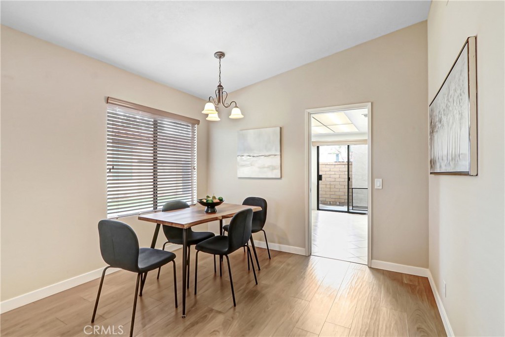 9849 Allesandro Court Rancho Cucamonga, CA 91730 - Photo 8 of 20 a view of a dining room with furniture and wooden floor