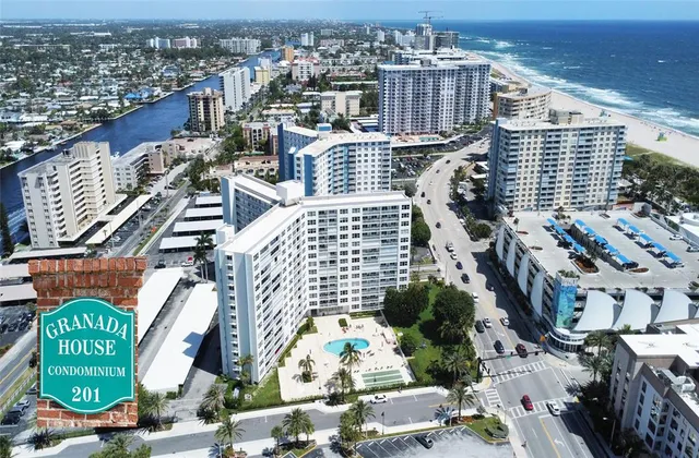 an aerial view of residential houses with outdoor space