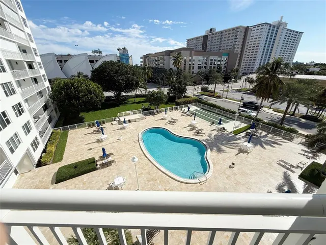 a view of a swimming pool from a balcony