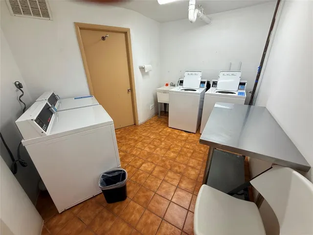 a bathroom with a sink toilet and a mirror