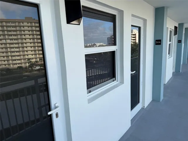 a view of a hallway with washer and dryer
