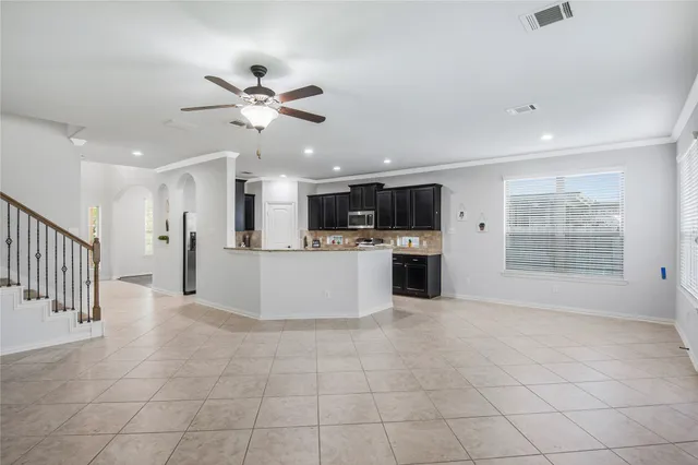 a view of a kitchen with a sink and a window