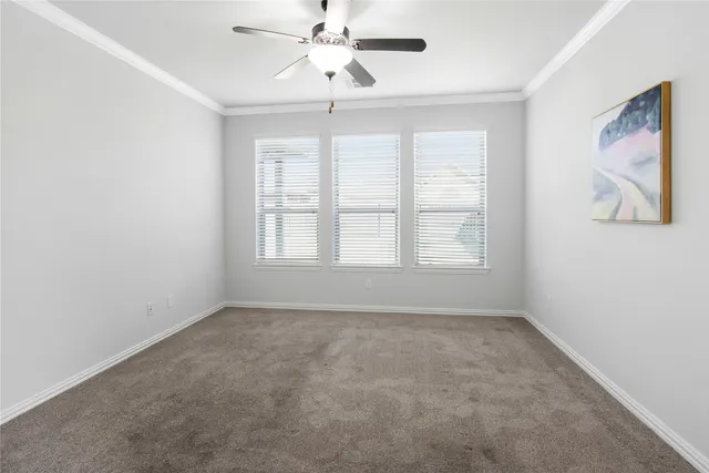 a view of an empty room with a bathroom