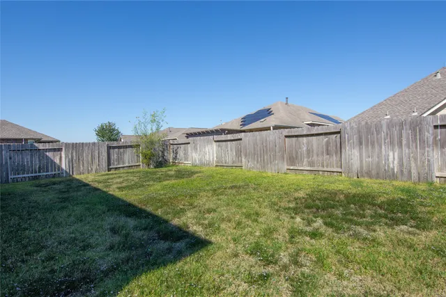 a front view of a house with a yard and porch