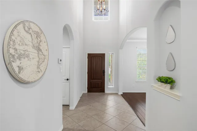 a view of a room with shelves and wooden floor
