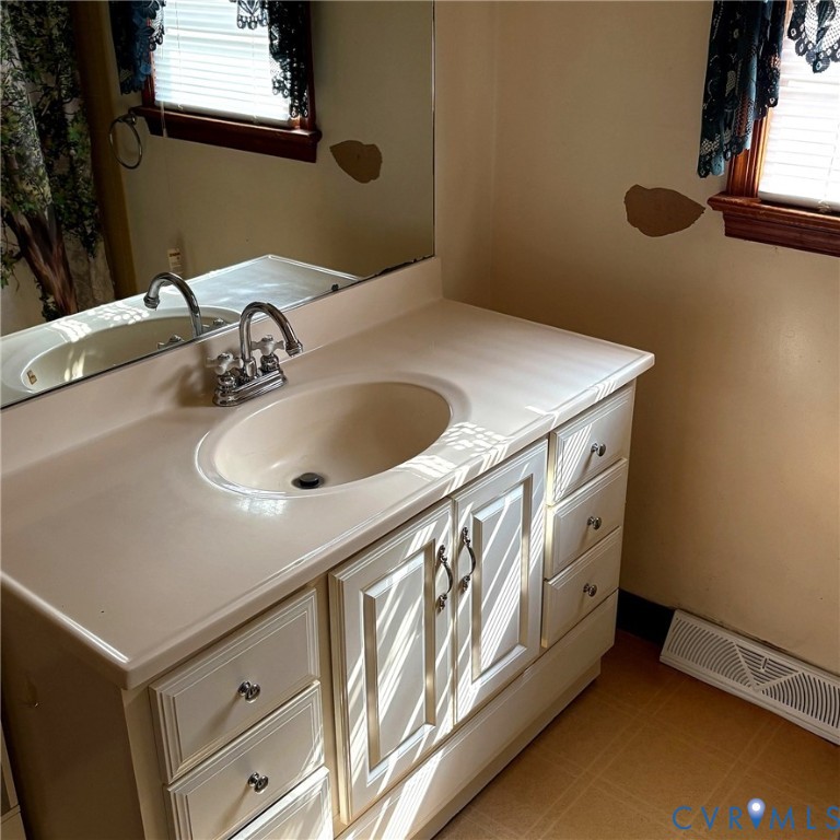 85 Frenchs Store Road Cumberland, VA 23040 - Photo 11 of 19 Bathroom vanity featuring a sink with a chrome fau