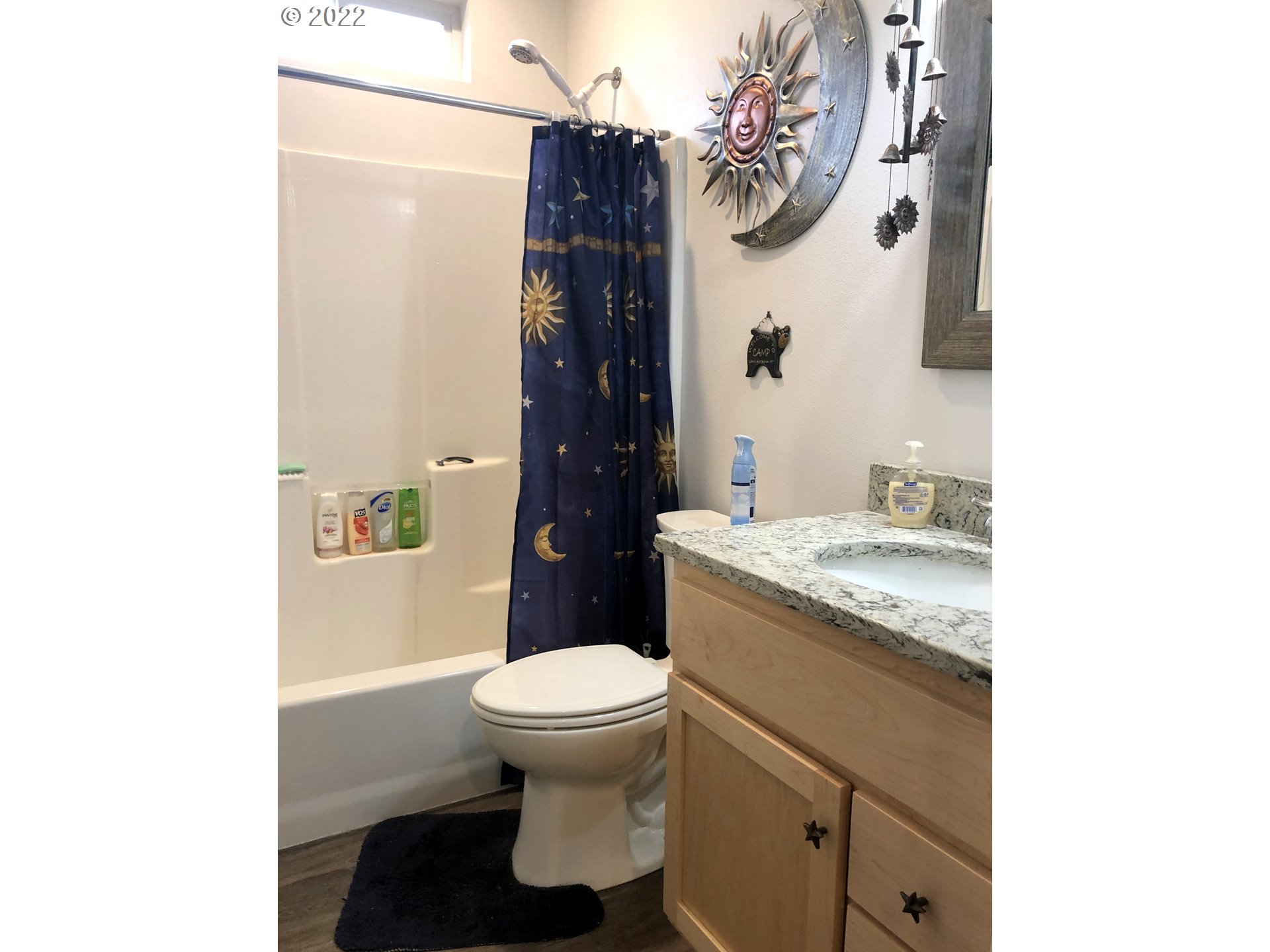 3760 E Street Springfield, OR 97478 - Photo 17 of 24 a bathroom with a granite countertop toilet sink and mirror