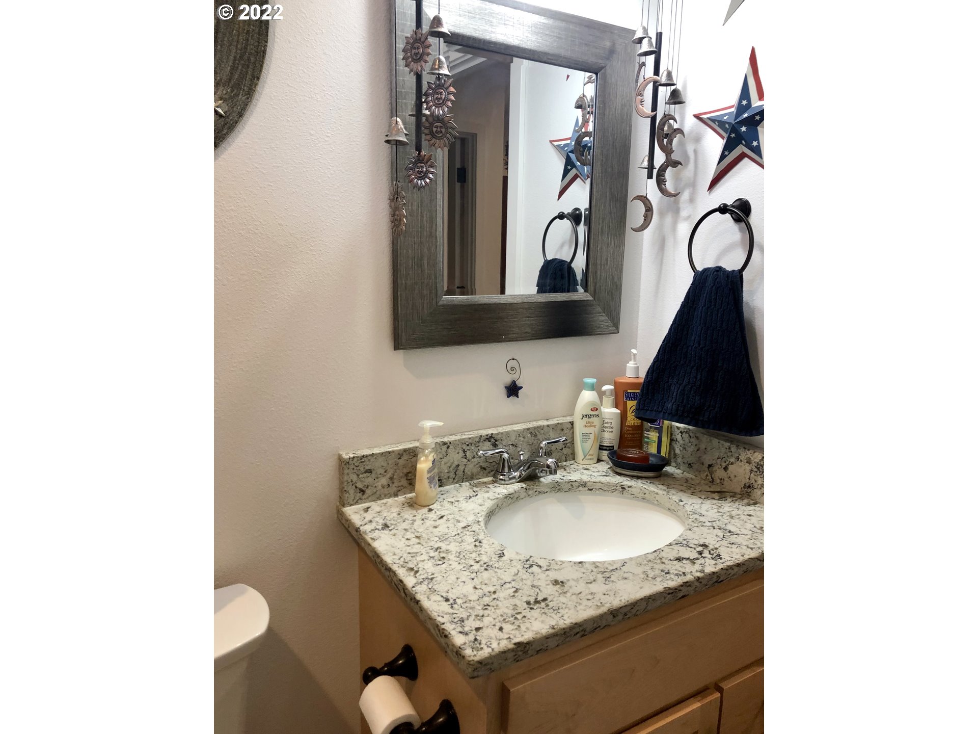 3760 E Street Springfield, OR 97478 - Photo 18 of 24 a bathroom with a granite countertop sink and a mirror