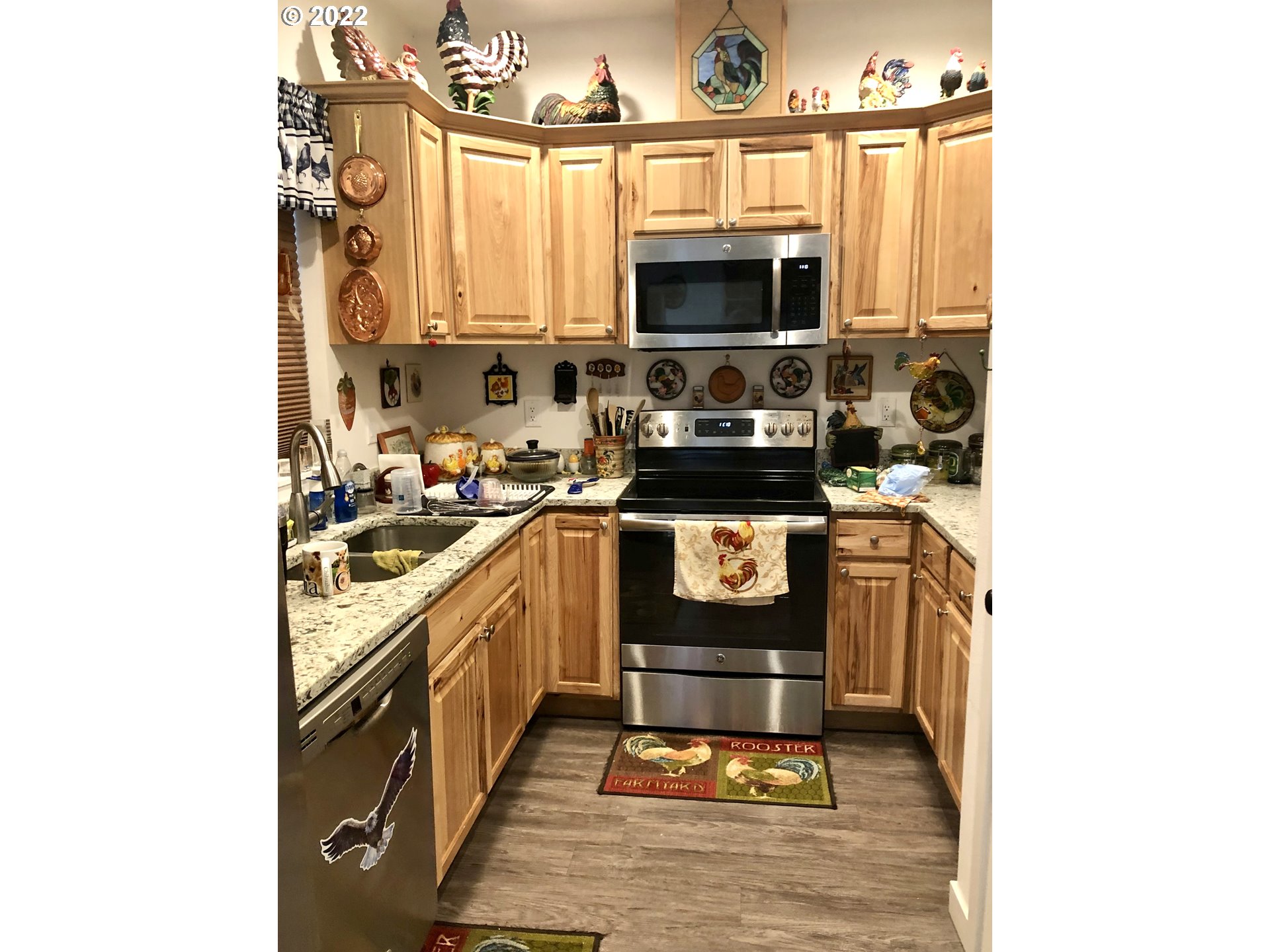 3760 E Street Springfield, OR 97478 - Photo 4 of 24 a kitchen with a stove a sink and a microwave