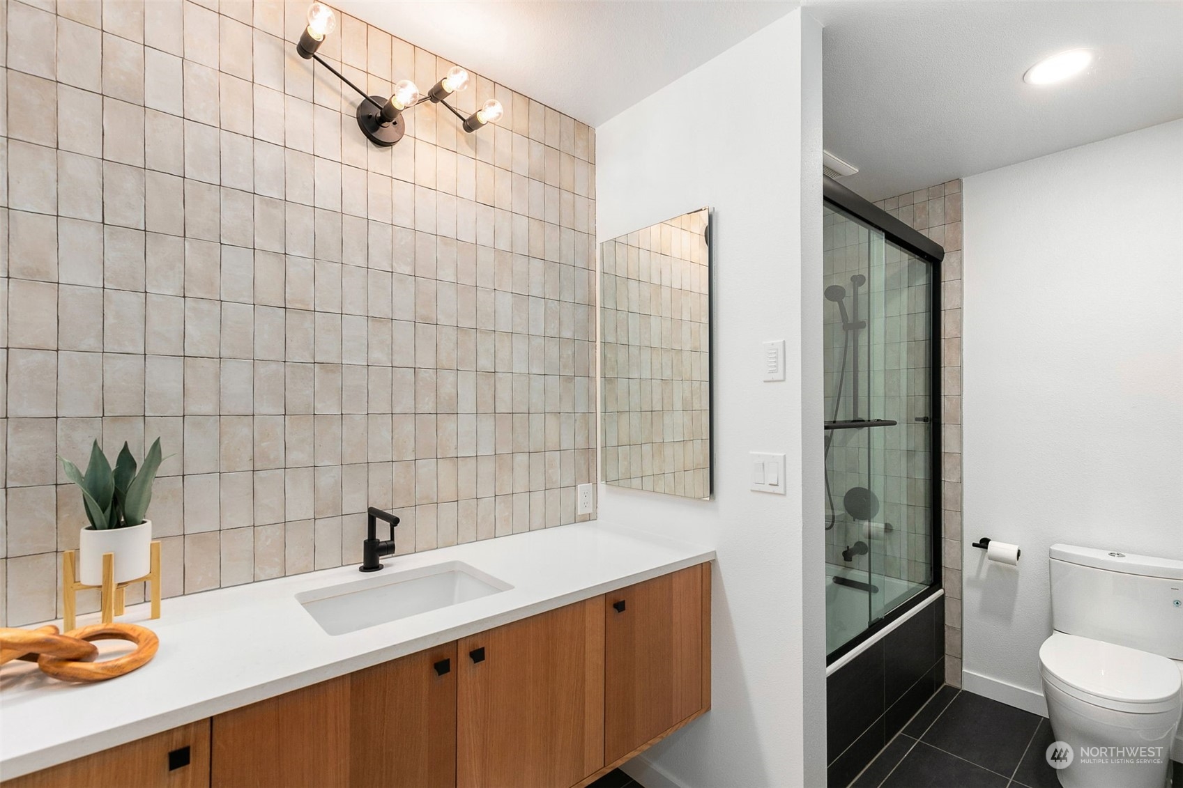 14255 147th Place Southeast Renton, WA 98059 - Photo 19 of 31 a bathroom with a double vanity sink toilet and shower