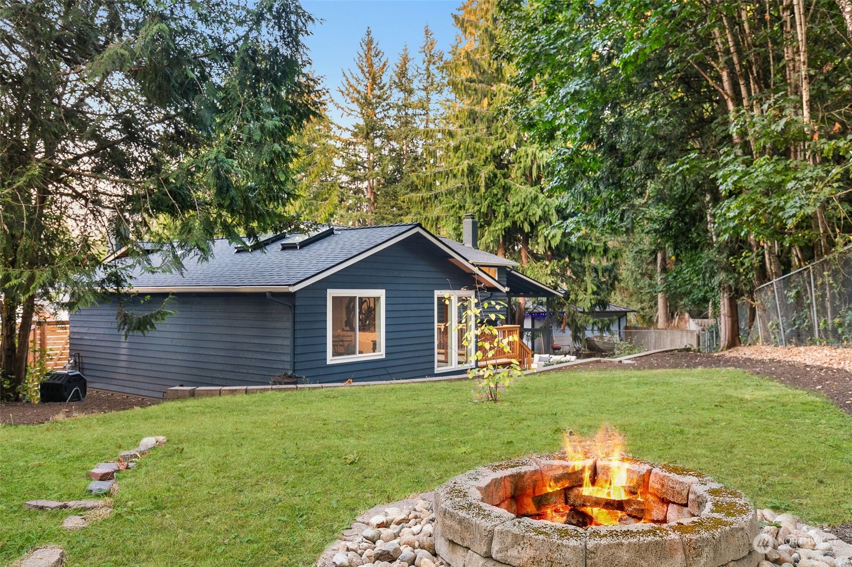 14255 147th Place Southeast Renton, WA 98059 - Photo 27 of 31 a front view of a house with a garden and trees