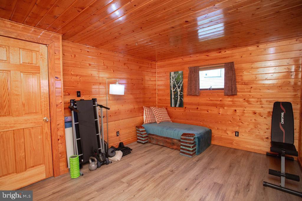 622 Spruce Avenue Pitman, NJ 08071 - Photo 15 of 47 a room with gym equipment and wooden floor