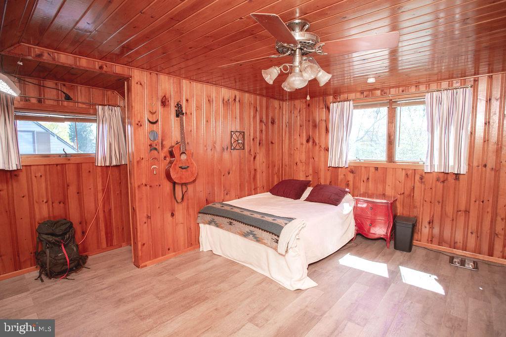 622 Spruce Avenue Pitman, NJ 08071 - Photo 26 of 47 a bedroom with a bed and a chandelier