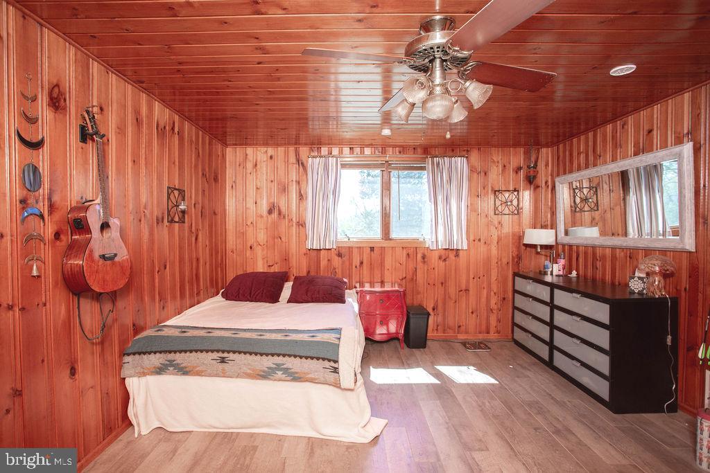 622 Spruce Avenue Pitman, NJ 08071 - Photo 27 of 47 a bedroom with furniture and a chandelier