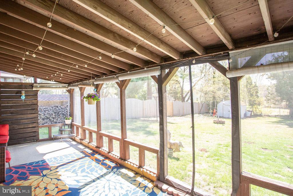 622 Spruce Avenue Pitman, NJ 08071 - Photo 39 of 47 a view of an empty room with a floor to ceiling window and wooden floor