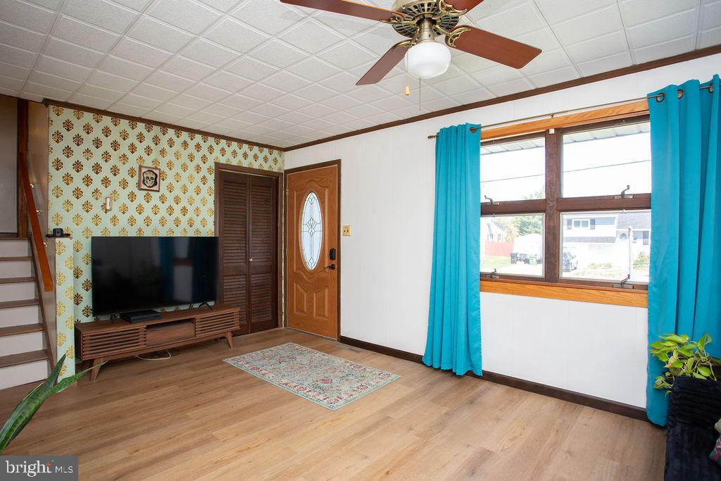 622 Spruce Avenue Pitman, NJ 08071 - Photo 8 of 47 a living room with a flat screen tv and a fireplace
