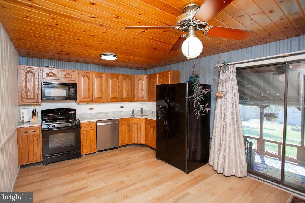 622 Spruce Avenue Pitman, NJ 08071 - Photo 9 of 47 a kitchen with stainless steel appliances granite countertop a refrigerator a stove top oven a sink and dishwasher