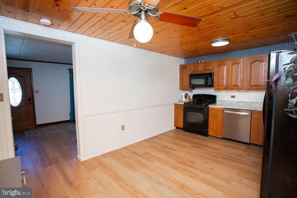622 Spruce Avenue Pitman, NJ 08071 - Photo 10 of 47 a kitchen with stainless steel appliances granite countertop a refrigerator a stove top oven a sink and dishwasher